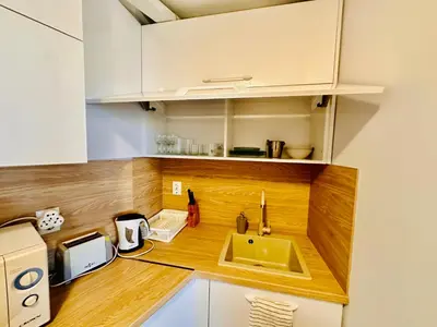 a kitchen with a sink and a counter top at Two-bed flat in Sunny Beach with pool view in Sunny Beach