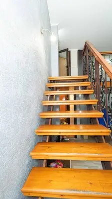 a set of wooden stairs in a building at Paradise Sarafovo Beach in Burgas City