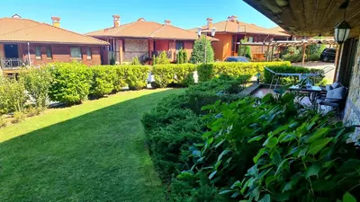 a yard with green plants and a house at Созопол Sozopol- SOZOPOLIS - MORE SUN 2В in Sozopol
