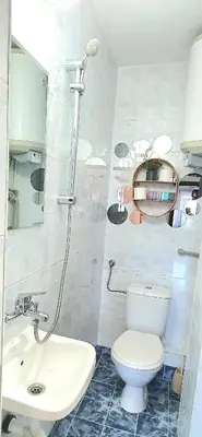 a bathroom with a toilet and a sink at Centro apart in Burgas City