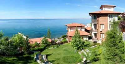 an image of a house with a view of the water at Garden of Eden Sea and Pool View in Sveti Vlas