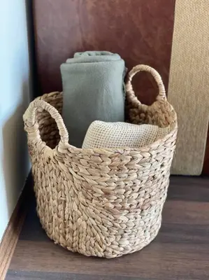 a basket with a vase in it on a table at Chic&Cozy Apartment in Nessebar in Nesebar