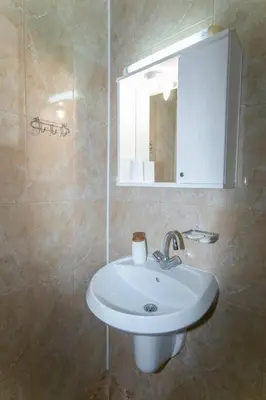 a bathroom with a sink and a mirror at Chic&Cozy Apartment in Nessebar in Nesebar