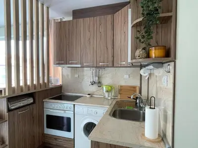 a kitchen with a sink and a washing machine at Chic&Cozy Apartment in Nessebar in Nesebar