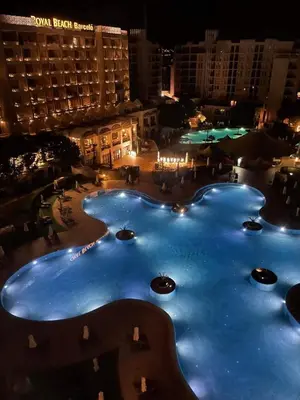 a view of a large pool at night at Z-apartment in Sunny Beach