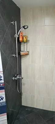 a bathroom with a shower with a shower head at Kavaci Studio Beach Sozopol in Sozopol