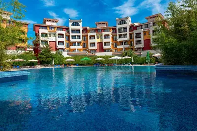 a swimming pool in front of a hotel at Menada Apartments in Marina Cape in Aheloy