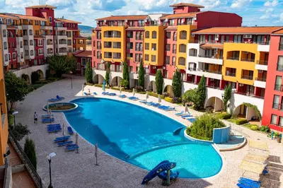 a swimming pool in the middle of some buildings at Menada Apartments in Marina Cape in Aheloy