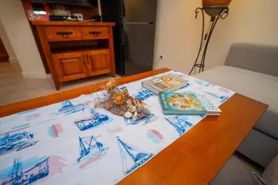 a table with a table cloth on top of it at SeaRent Dream Home in Santa Marina - 2 bedrooms, 2 baths and a HUGE terrace in Sozopol
