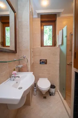 a bathroom with a sink and a toilet at SeaRent Dream Home in Santa Marina - 2 bedrooms, 2 baths and a HUGE terrace in Sozopol