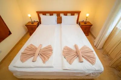 a bedroom with a bed with bows on it at SeaRent Dream Home in Santa Marina - 2 bedrooms, 2 baths and a HUGE terrace in Sozopol