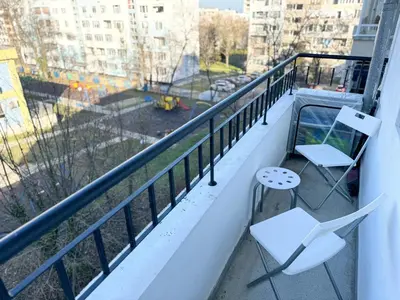 a balcony with two chairs and a view of a city at Restful Apartment for 4 Guests in Burgas in Burgas City