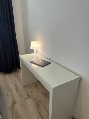 a white desk with a lamp and a laptop on it at Varna Bulgaria 2-Room Apartment Asparuhovo Zelenika Bulgarien Warna 2-Zimmer in Galata