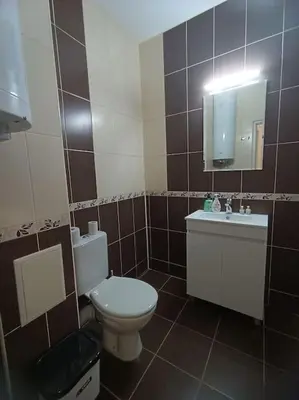 a bathroom with a toilet and a sink and a mirror at Varna Bulgaria 2-Room Apartment Asparuhovo Zelenika Bulgarien Warna 2-Zimmer in Galata