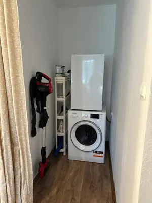 a washer and dryer in a corner of a room at Varna Bulgaria 2-Room Apartment Asparuhovo Zelenika Bulgarien Warna 2-Zimmer in Galata