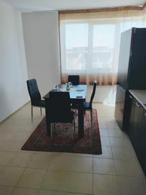 a dining room with a table and chairs at Ред хаус in Sunny Beach