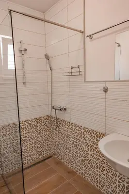 a bathroom with a shower and a sink at July's Guest House in Primorsko