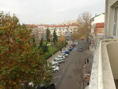 a view of a city street with cars parked at Luxury Versailles Apartments Center Opera in Burgas City