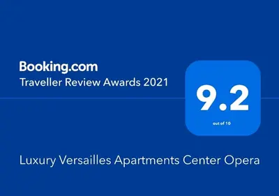 a blue box with the text traveler review awards at Luxury Versailles Apartments Center Opera in Burgas City