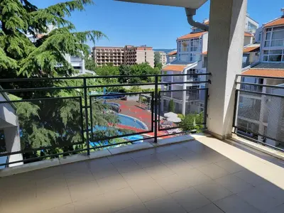 an apartment balcony with a view of a pool at Complex ELIT Cacao Beach - Apartments for rent- ЕЛИТ Слънчев бряг in Sunny Beach