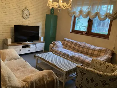 a living room with two couches and a tv at GoodRest Sozopol in Sozopol