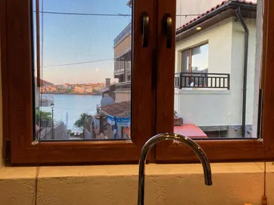 a kitchen sink with a view of a window at GoodRest Sozopol in Sozopol