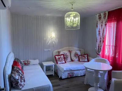 a living room with a couch and a table at GoodRest Sozopol in Sozopol