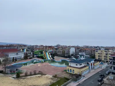 an aerial view of a city with a water park at Хотел ЮГ in Primorsko
