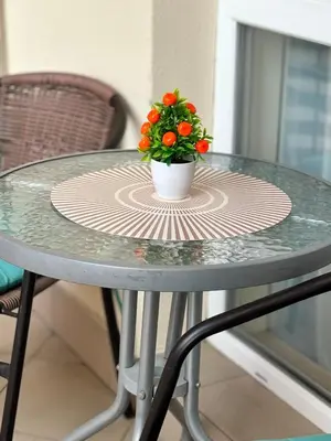 a table with a vase with a plant on it at Apartment Nani -Sunny beach in Sunny Beach