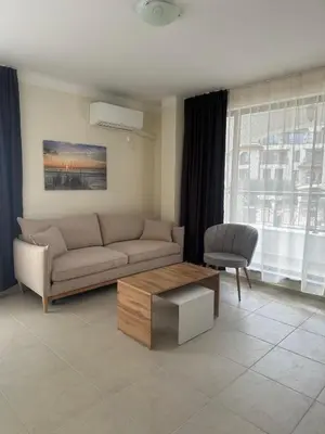 a living room with a couch and a coffee table at Sea View Sarafovo in Sarafovo