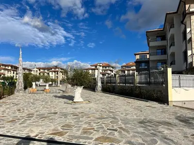 a stone walkway in front of some buildings at Sea View Sarafovo in Sarafovo