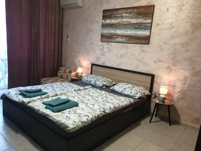 a bedroom with a bed with two pillows on it at Cozy apartment by Julie in Sunny Beach