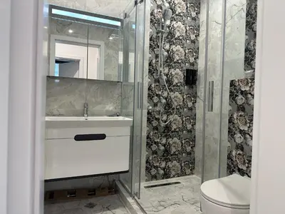 a bathroom with a sink and a shower at Сарафово Лукс Тераса Първа Линия in Sarafovo