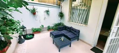 a patio with two blue couches and a table at The Cozy Hub, Varna in Varna City