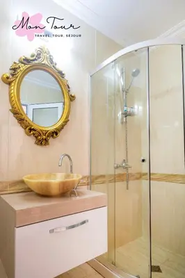 a bathroom with a sink and a mirror at Mon Tour apartments in Sunny Beach