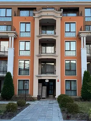 an orange building with a walkway in front of it at Premier Fort Beach ap. №376 section: E-3 in Sveti Vlas