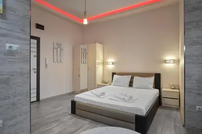 a bedroom with a large white bed in a room at Studio in Sarafovo with Private Parking Spot by Flat Mаnаger in Burgas City