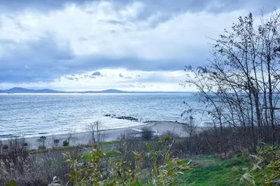 a view of the ocean with a sandy beach at Studio in Sarafovo with Private Parking Spot by Flat Mаnаger in Burgas City