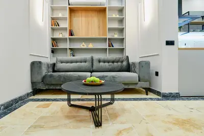 a living room with a couch and a table at Florance Rentals Luxury Apartments in Burgas in Burgas City
