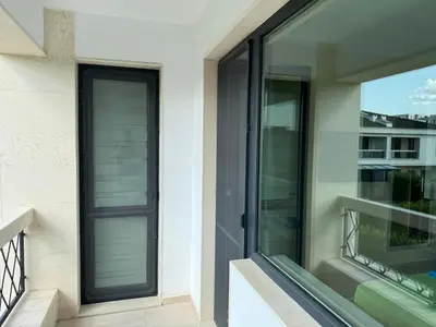a glass door on the side of a house at Luxury Sea Villas - Kabalan in Burgas City