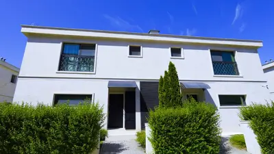 a white house with bushes in front of it at Luxury Sea Villas - Kabalan in Burgas City