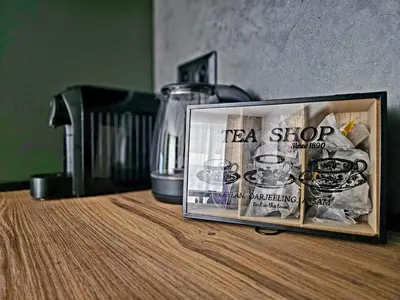 a tea shop sign sitting on top of a table at Central Park Galleria in Burgas City
