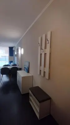 a living room with a couch and a table at Студия Sunset Beach Солнечный Берег in Sunny Beach