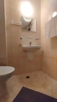 a bathroom with a sink and a toilet at Студия Sunset Beach Солнечный Берег in Sunny Beach