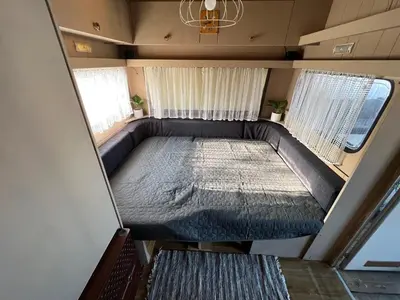 an overhead view of a bed in a tiny house at Лятна каравана “Айтата” in Kiten