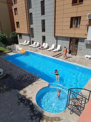a group of people in a swimming pool at Studio Sveti Vlas SEA BREEZE 3 in Sveti Vlas