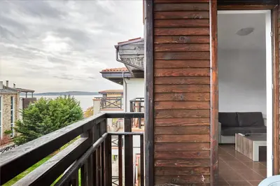 a balcony with a view of the ocean at Апартамент на плаж Градина in Chernomorets