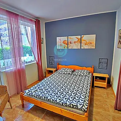 a bedroom with a bed in a room with a window at BRAVO 5 - Sunny Beach Center in Sunny Beach