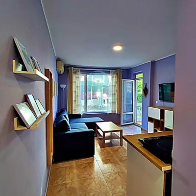 a living room with a couch and a table at BRAVO 5 - Sunny Beach Center in Sunny Beach