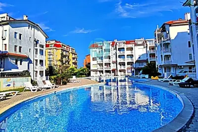 a large swimming pool in a city with buildings at BRAVO 5 - Sunny Beach Center in Sunny Beach